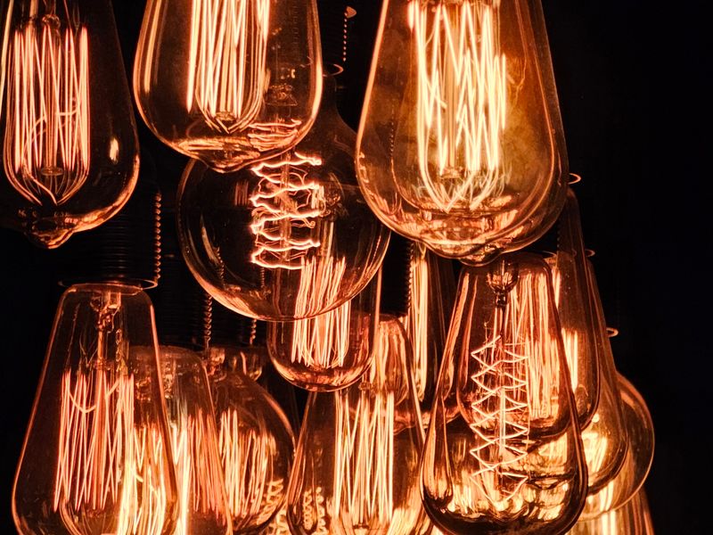 Close-up of a glowing bulb filament in modern surround — the enthusiast tier, specified and tested like lab equipment.